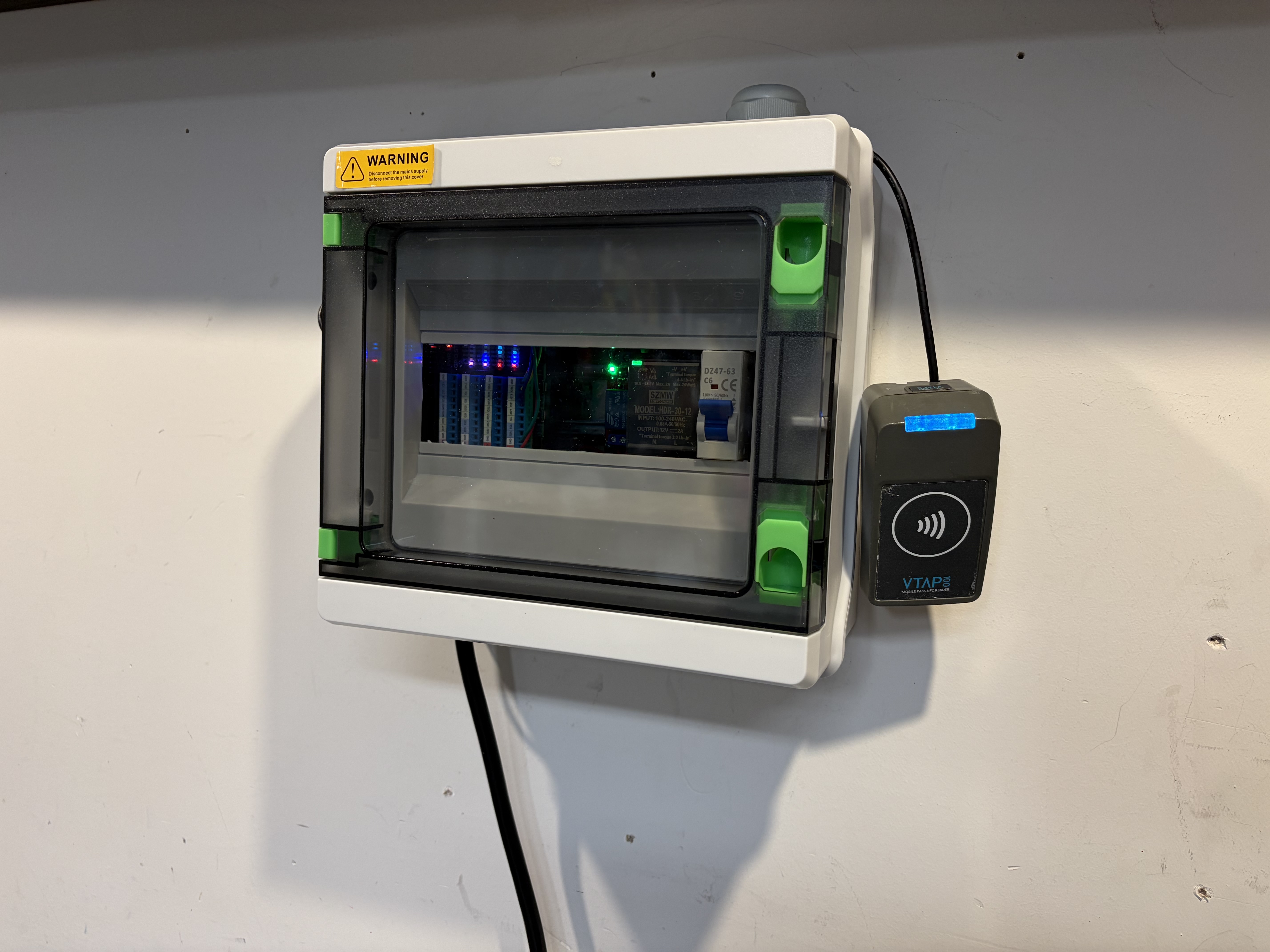 Installed front door access controller with enclosure and VTAP mobile pass reader